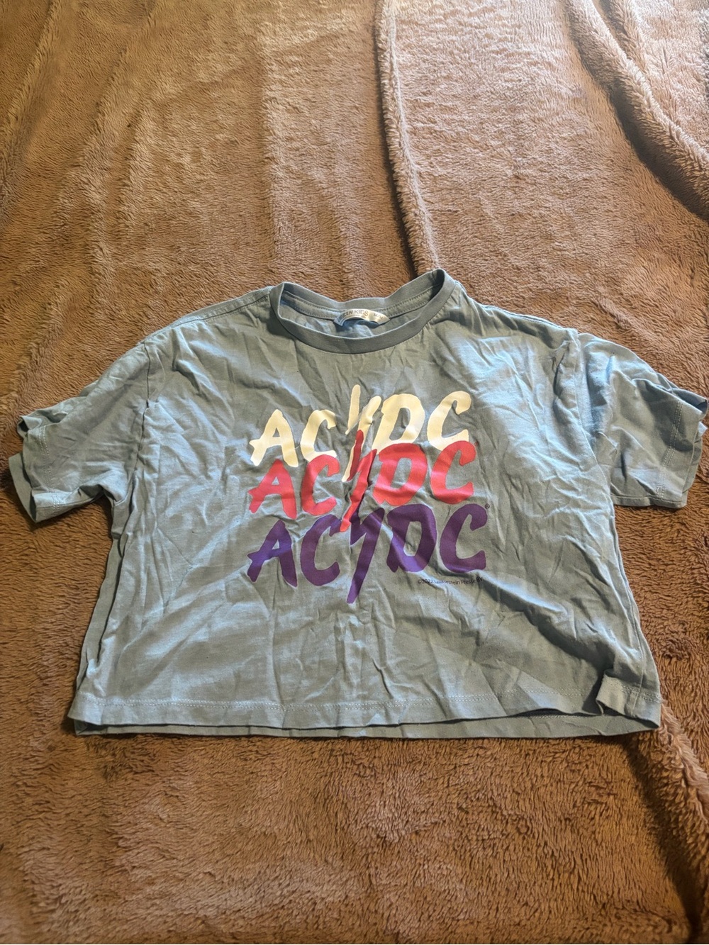 Urban Planet Light Blue AC/DC Graphic Tee with Red, Purple, and Cream Logo